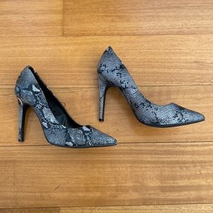 Snakeskin high heeled shoes